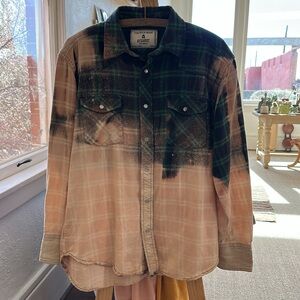 Distressed flannel with cute mushroom decal add on back.